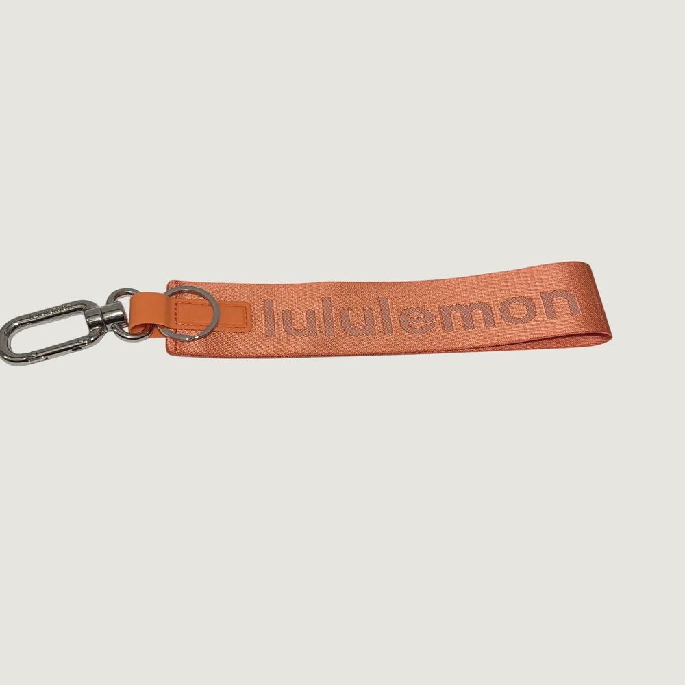 Lululemon Never Lost Keychain Wristlet Lanyard Coral Orange Peach Raised Logo